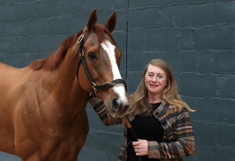 Assistant trainer Laura Moquett in the barn area at Oaklawn Racing Casino Resort Friday with Whitmore, a winner of $2,821,350.00 – Photo by Richard Rasmussen of The Sentinel-Record