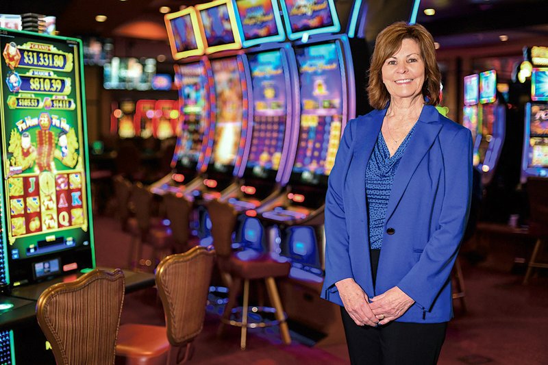 Patti Pendleton, head of Oaklawn Racing Casino Resort’s security division, has her photo taken on the casino floor. –Photo by Grace Brown of the Sentinel-Record