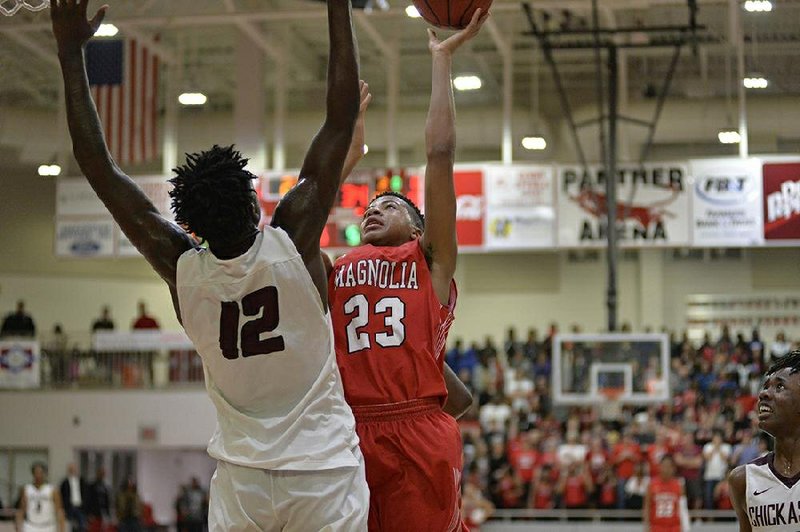 a Banner-News file photos shows Colby Garland (23) as he goes up for a contested shot against a Morrilton defender in the 2019 Arkansas Class 4A Class Basketball Tournament that was held in Panther Arena. This year's tournament site will be held in either northeast or northwest Arkansas in 2020. The site will be announced Thursday. 