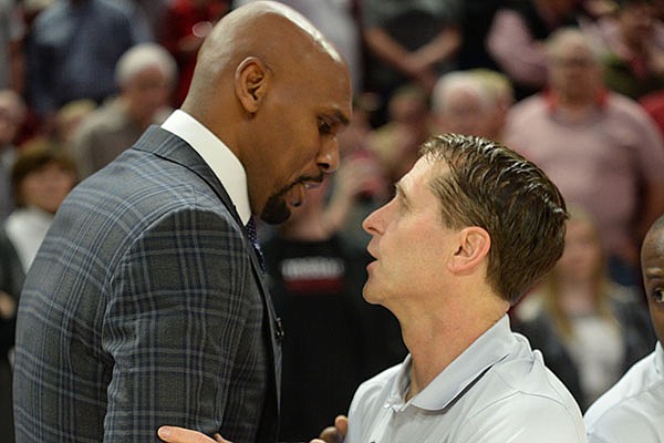 Vanderbilt coach Jerry Stackhouse (left) and Arkansas coach Eric Musselman speak prior to a game Wednesday, Jan. 15, 2020, in Fayetteville. 