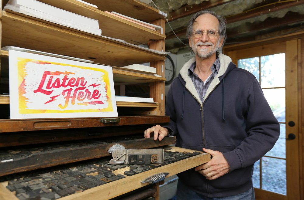 "My belief is that maps enable us to see other places through a different lens, that they help us see that while other places are different and unique, they all have goodness and strength," says map maker Gregory Mitchell. (NWA Democrat-Gazette/David Gottschalk)