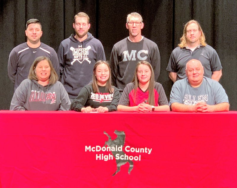 RICK PECK/SPECIAL TO MCDONALD COUNTY PRESS Kristen Cornell (bottom, second from left) recently singed a letter of intent to play softball at Allen County Community College in Iola, Kan. Front row, left to right, is Sheila Cornell (mom), Kristen Cornell, Kaylee Cornell (sister) and Randy Cornell (dad). Back row are MCHS coaches Skyler Rawlins, Kyle Smith, Lee Smith and Heath Alumbaugh.