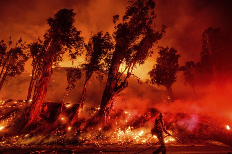 In this Nov. 1, 2019, file photo, flames from a backfire consume a hillside as firefighters battle the Maria Fire in Santa Paula, Calif. The decade that just ended was by far the hottest ever measured on Earth, capped off by the second-warmest year on record, NASA and the National Oceanic and Atmospheric Administration reported Wednesday. - AP Photo/Noah Berger