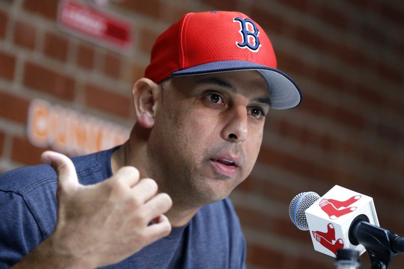 In this Sept. 9, 2019, file photo, Boston Red Sox manager Alex Cora talks about the dismissal of president of baseball operations Dave Dombrowski, during a news conference before the team's baseball game against the New York Yankees in Boston. Cora was fired by the Red Sox on Tuesday, Jan. 14, 2020, a day after baseball Commissioner Rob Manfred implicated him in the sport's sign-stealing scandal. (AP Photo/Michael Dwyer, File)