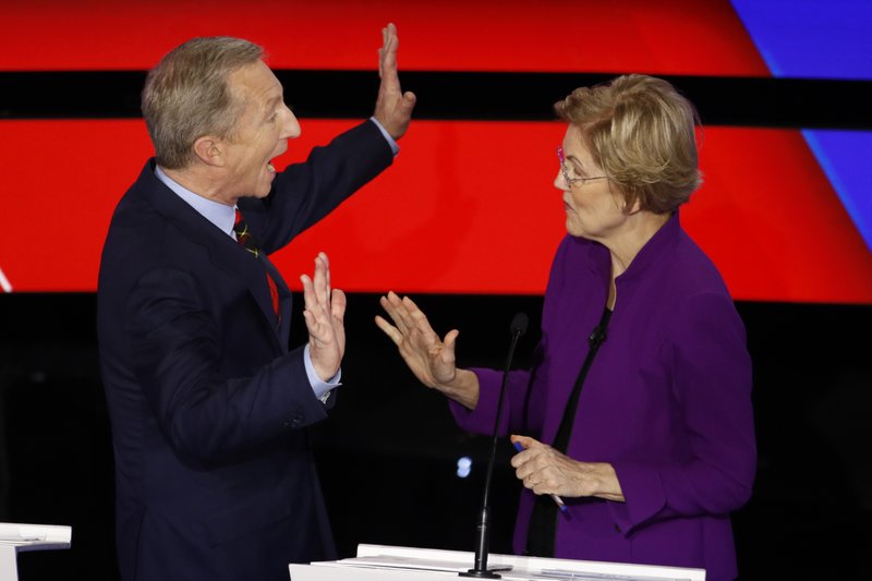 Democratic presidential candidates businessman Tom Steyer, left and Sen. Elizabeth Warren, D-Mass., talk during a break Tuesday during a Democratic presidential primary debate hosted by CNN and the Des Moines Register in Des Moines, Iowa. - AP Photo/Patrick Semansky