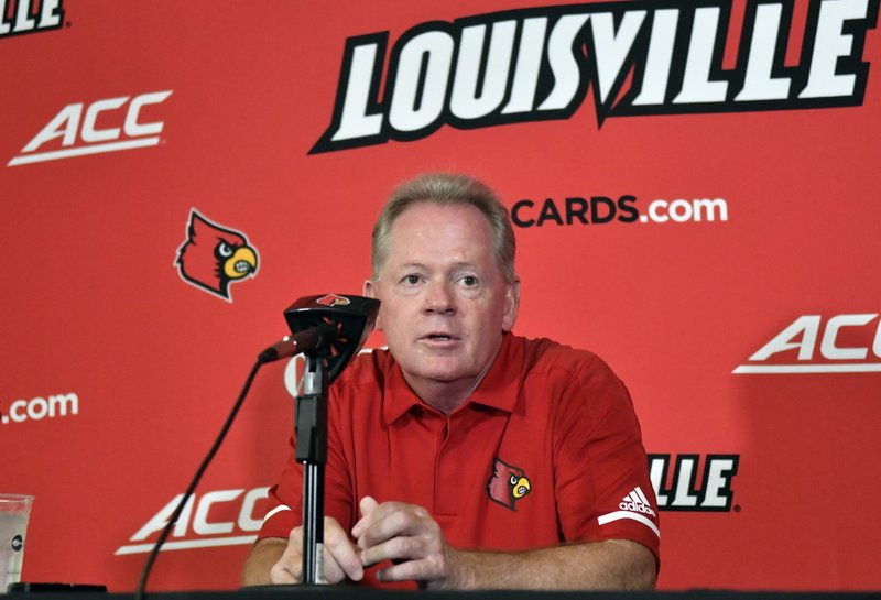 In this Aug. 11, 2018, file photo, then-University of Louisville head football coach Bobby Petrino speaks to reporters during Louisville Football Media Day, in Louisville, Ky.  
(AP Photo/Timothy D. Easley, File)