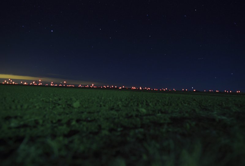 This Jan. 2, 2020, photo shows red lights from wind turbines in the distance in the area of Genoa and Hugo, Colo., where sightings of unidentified large drones in the air have been reported.
 (RJ Sangosti/The Denver Post via AP)