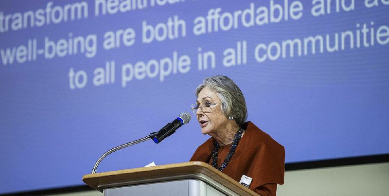 Calling America’s health care system “a disease care system, not a health care system,” Alice Walton announces plans for a Whole Health Institute during the Northwest Arkansas Council winter meeting Wednesday at Crystal Bridges Museum of American Art in Bentonville. She said Dr. Tracy Gaudet, formerly of the U.S. Department of Veterans Affairs, will lead a Bentonville institute with the mission of changing the approach to health care nationwide.
(NWA Democrat-Gazette/Ben Goff)