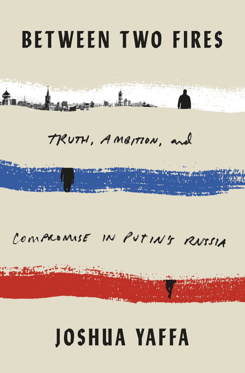 This cover image released by Tim Duggan Books shows "Between Two Fires: Truth, Ambition and Compromise in Putin's Russia" by Joshua Yaffa. - Tim Duggan Books via The Associated Press