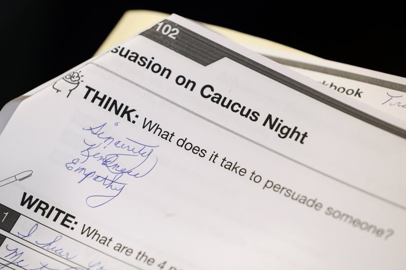 A question in a training booklet is seen during a Jan. 9 caucus training meeting at the local headquarters for Democratic presidential candidate former South Bend, Ind., Mayor Pete Buttigieg in Ottumwa, Iowa. - AP Photo/Charlie Neibergall