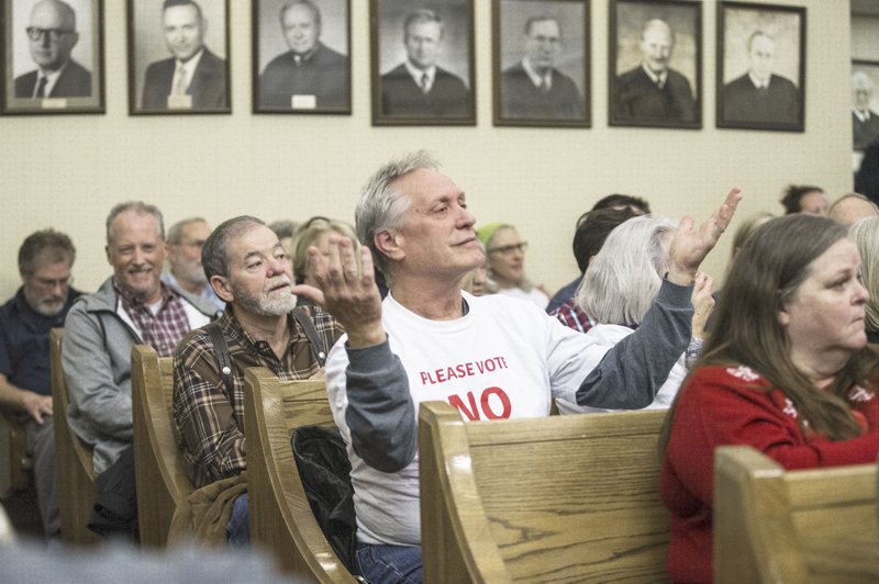 Mike Sonnier of Monte Ne reacts Dec. 18 to a remark by a quarry representative during the Benton County Planning Board meeting in Bentonville. The meeting discussed the limestone quarry proposed for a site just Northeast from Lowell. (File Photo/NWA Democrat-Gazette/Ben Goff)