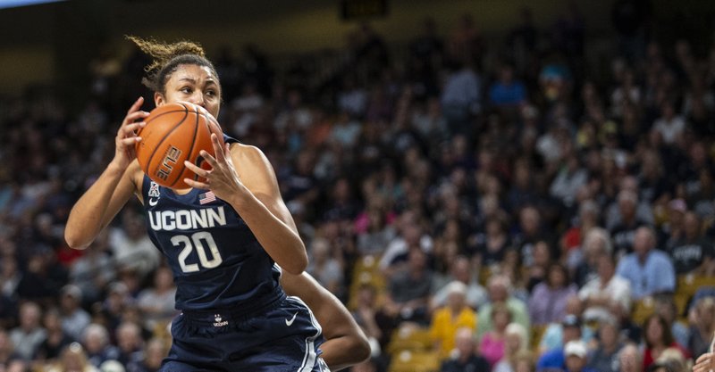 Connecticut forward Olivia Nelson-Ododa (20) grabs a rebound during the first half of Thursday's game against Central Florida in Orlando, Fla. - Photo by Willie J. Allen Jr. of The Associated Press