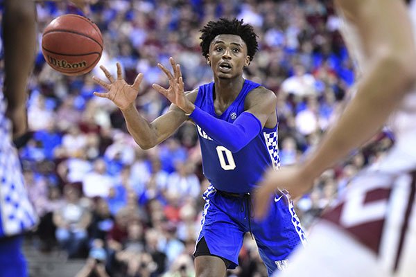 Kentucky guard Ashton Hagans (0) passes to a teammate during the first half of the team's NCAA college basketball game against South Carolina on Wednesday, Jan. 15, 2020, in Columbia, S.C. South Carolina won 81-78. (AP Photo/Sean Rayford)

