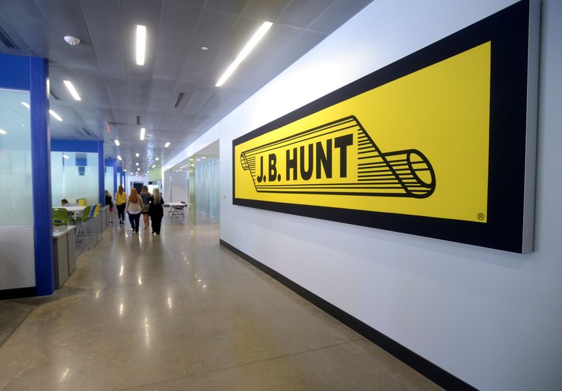 In this 2017 file photo, people walk in the break area inside the new expansion at the J.B. Hunt Transport headquarters in Lowell.