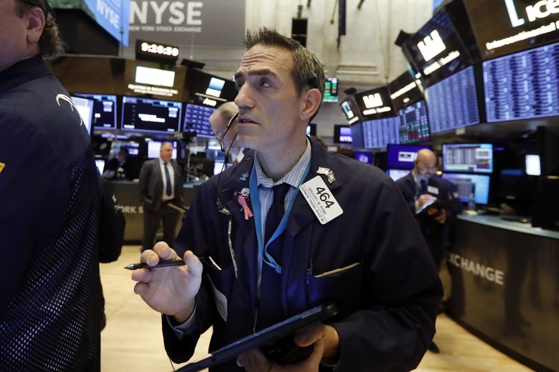 FILE - In this Jan. 10, 2020, file photo trader Gregory Rowe works on the floor of the New York Stock Exchange. The U.S. stock market opens at 9:30 a.m. EST on Friday, Jan. 17 (AP Photo/Richard Drew, File)