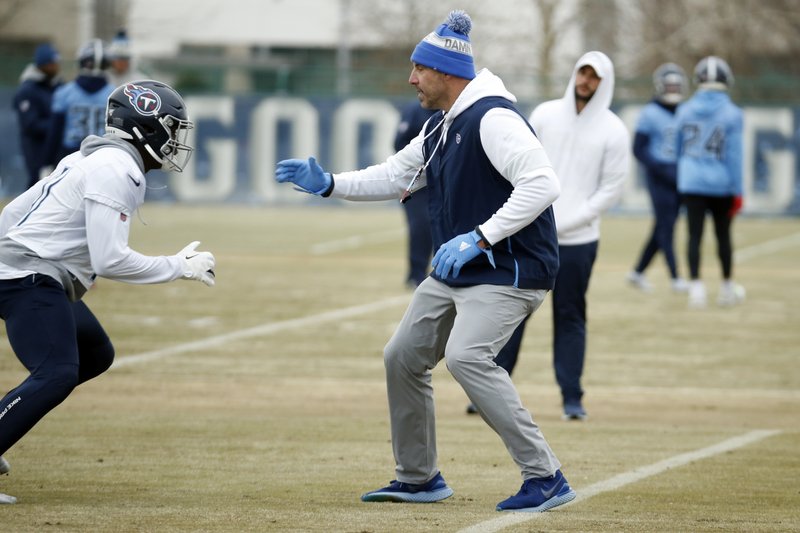 Tennessee Titans head coach Mike Vrabel takes the role of a defender against wide receiver A.J. Brown (11) during a practice Friday in Nashville, Tenn. The Titans are scheduled to face the Kansas City Chiefs in the AFC Championship game Sunday. - Photo by Mark Humphrey of The Associated Press