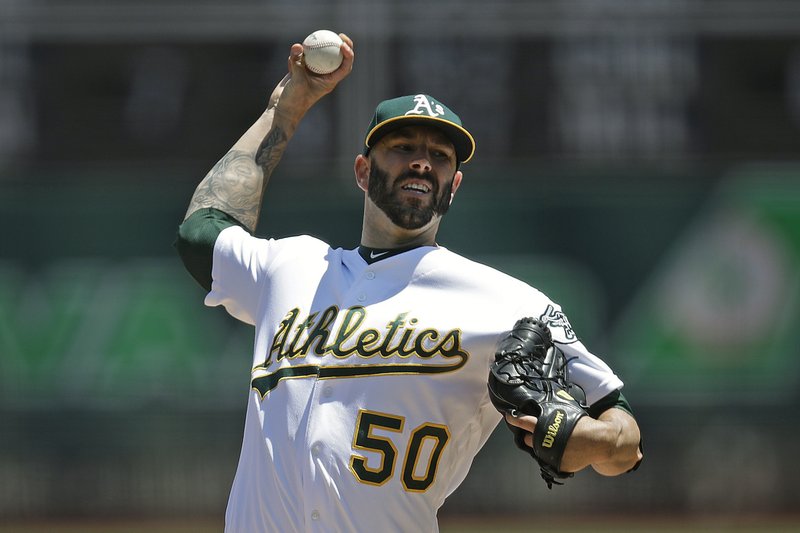 Oakland Athletics pitcher Mike Fiers works against the Texas Rangers in the first inning of a July 28, 2019, game, in Oakland, Calif. When future generations are documenting baseball history, Fiers will surely be remembered as one of the game's most significant figures. Not necessarily for what he did on the field, though tossing a pair of no-hitters is certainly a worthy achievement. - Photo by Ben Margot of The Associated Press