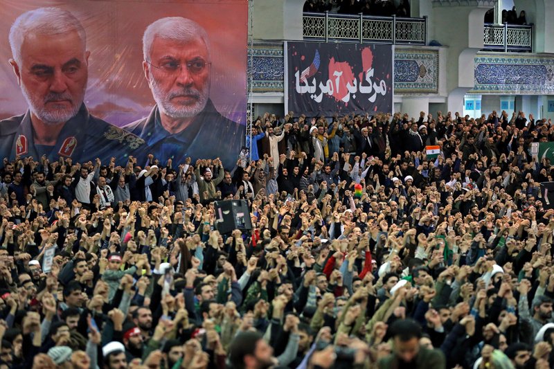 In this picture released by the official website of the office of the Iranian supreme leader, worshippers chant slogans during Friday prayers ceremony, as a banner show Iranian Revolutionary Guard Gen. Qassem Soleimani, left, and Iraqi Shiite senior militia commander Abu Mahdi al-Muhandis, who were killed in Iraq in a U.S. drone attack on Jan. 3, and a banner which reads in Persian: "Death To America, "at Imam Khomeini Grand Mosque in Tehran, Iran, Friday. Iran's supreme leader said in his sermons President Donald Trump is a "clown" who only pretends to support the Iranian people but will "push a poisonous dagger" into their backs, as he struck a defiant tone in his first Friday sermon in Tehran in eight years. - Office of the Iranian Supreme Leader via AP