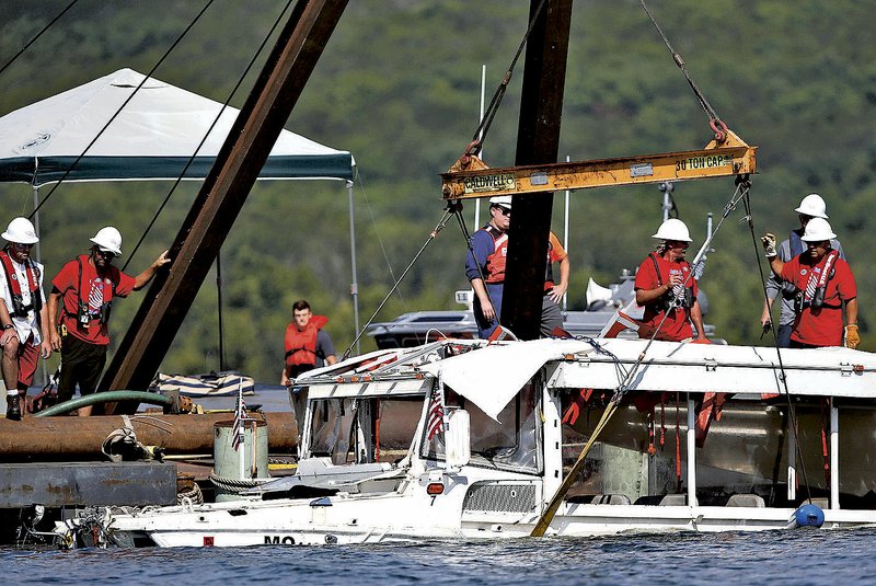 A duck boat that sank in Table Rock Lake at Branson, Mo., is raised after it went down the evening of July 19 after a thunderstorm generated near-hurricane strength wind, killing 17 people. The owner of the boat settled its final lawsuit for an undisclosed amount. (File photo/Nathan Papes/The Springfield News-Leader)