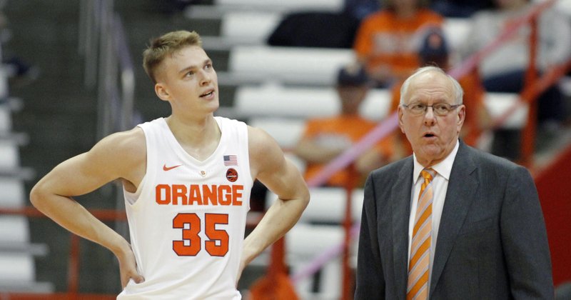 In this Oct. 31, 2018, file photo, Syracuse head coach Jim Boeheim, right, talks to his son Buddy Boeheim, left, during the first half of an NCAA college basketball game against Le Moyne in Syracuse, N.Y. 
