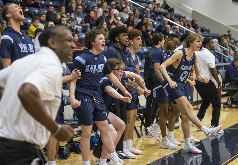 The Springdale Har-Ber bench erupts in cheers after a basket to tie the score 55-55 with just over a minute remaining vs Bentonville West Friday, Jan. 17, 2020, at Wolverine Arena in Centerton.