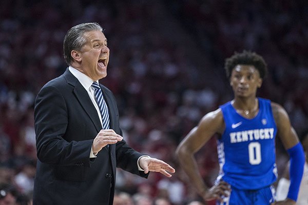Kentucky coach John Calipari yells while guard Ashton Hagans (0) looks on during a game against Arkansas on Saturday, Jan. 18, 2020, in Fayetteville.