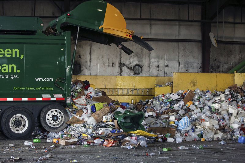 In this Oct. 2018 file photo, recyclables are being unloaded from a truck at the Waste Management Recycling Facility in Little Rock.