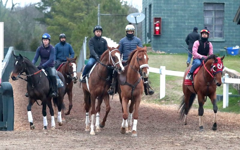 Exercise riders train their horses Friday at Oaklawn Racing Casino Resort. The 2020 live race meet starts Friday at Oaklawn. - Photo by Richard Rasmussen of The Sentinel-Record