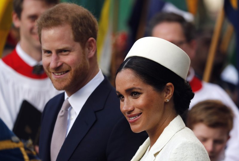 FILE - In this Monday, March 11, 2019 file photo, Britain's Prince Harry and Meghan, the Duchess of Sussex leave after the Commonwealth Service at Westminster Abbey in London. Prince Harry and Meghan Markle are to no longer use their HRH titles and will repay &#xa3;2.4 million of taxpayer's money spent on renovating their Berkshire home, Buckingham Palace announced Saturday, Jan. 18. 2020. (AP Photo/Frank Augstein, file)