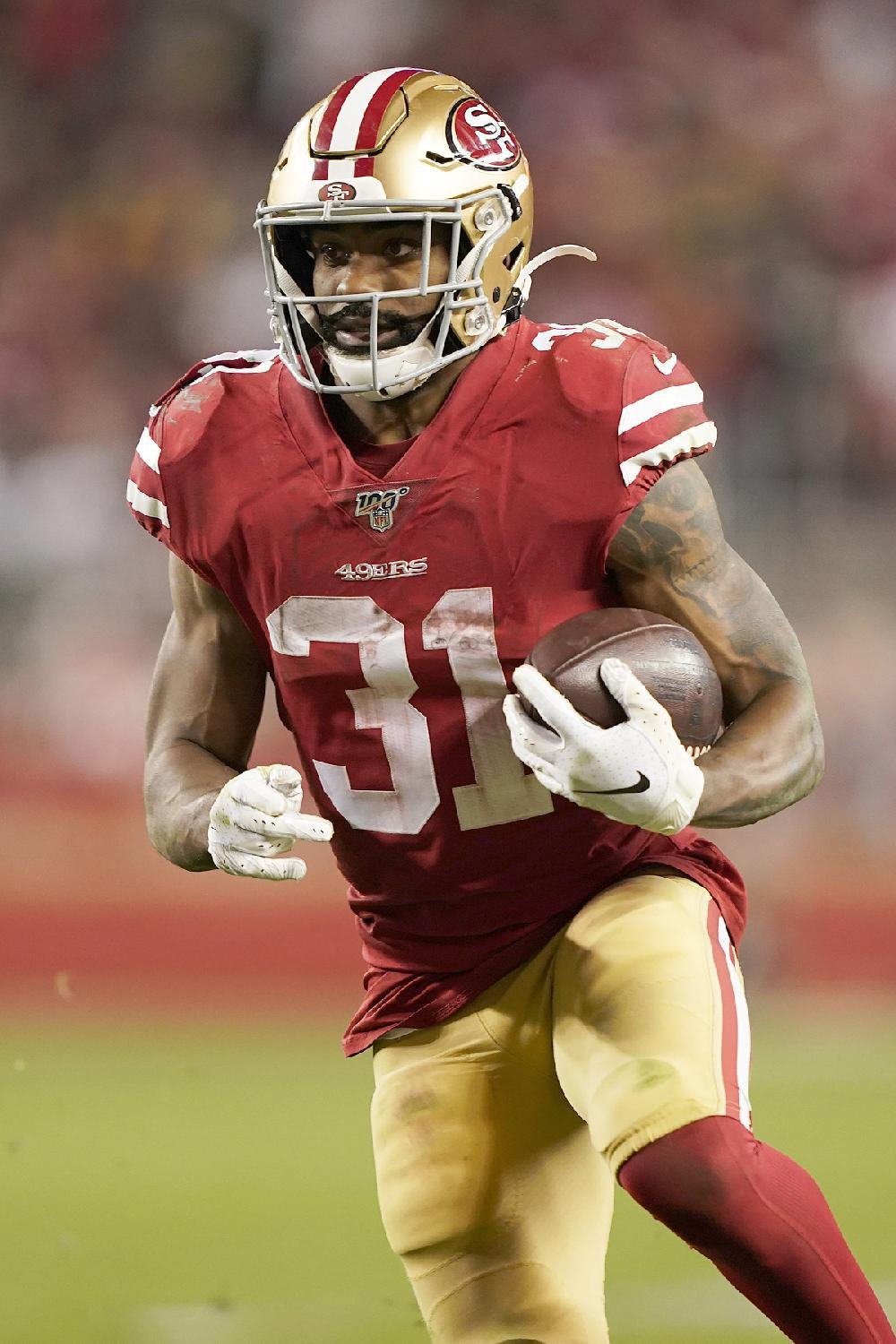 San Francisco 49ers running back Raheem Mostert (31) runs against