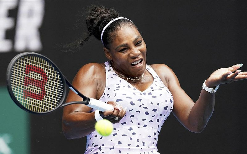 Serena Williams of the United States makes a forehand return to Russia’s Anastasia Potapova during their Australian Open first-round singles match earlier today in Melbourne, Australia. Williams won 6-0, 6-3.