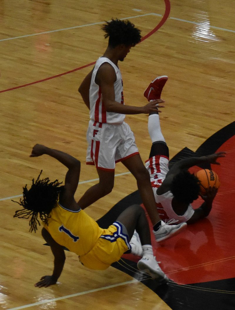 MARK HUMPHREY ENTERPRISE-LEADER/Farmington senior Marqwaveon Watson dives on the floor to disrupt a Hot Springs Lakeside fast-break. Lakeside won 57-54 on Friday during tournament action at Cardinal Arena.