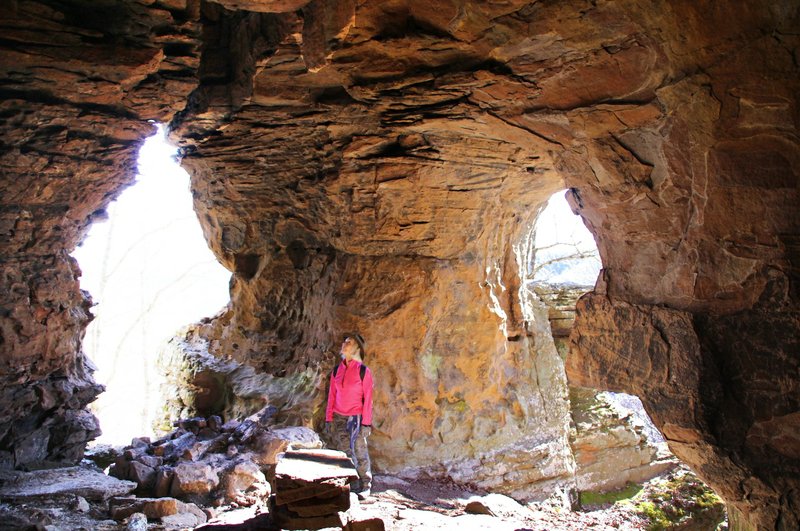 Sandstone Castle captivates Norma Senyard on Jan. 7, 2020, during an outing with the NWA Hiking Meetup group in the Richland Creek Wilderness Area. (Special to the Democrat-Gazette/Bob Robinson) 