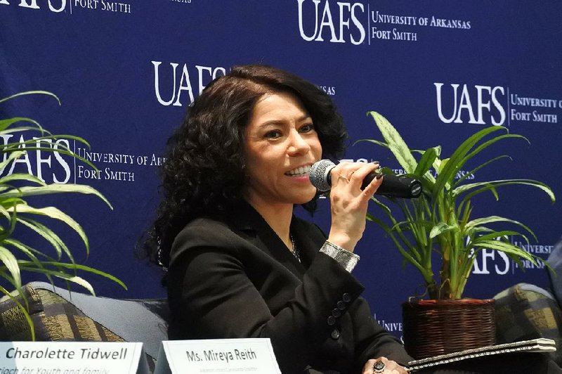 Mireya Reith, executive director of the Arkansas United Community Coalition, speaks Monday during the University of Arkansas at Fort Smith’s annual Martin Luther King Jr. breakfast panel. 