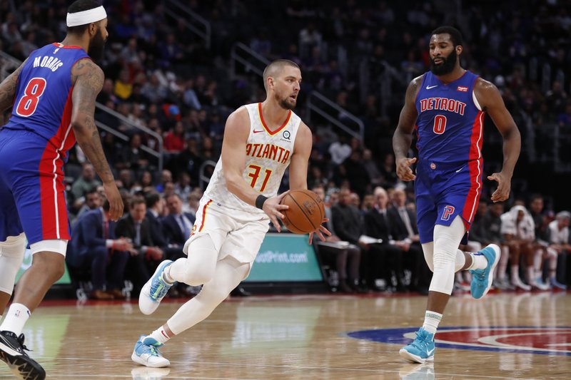 FILE - In this Nov. 22, 2019, file photo, Atlanta Hawks forward Chandler Parsons (31) passes the ball during the second half of an NBA basketball game against the Detroit Pistons in Detroit. Parsons' attorneys say the Hawks forward suffered &#x201c;severe and permanent injuries&quot; in a car wreck last week that could jeopardize his career. (AP Photo/Carlos Osorio, File)