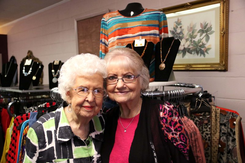 Augusta "Gussy" Gray and Laura Kinard pose for a photo inside The Classic Dress Shop in Smackover Jan. 17. Gray and Kinard plan to close the shop after 51 years by the end of February.