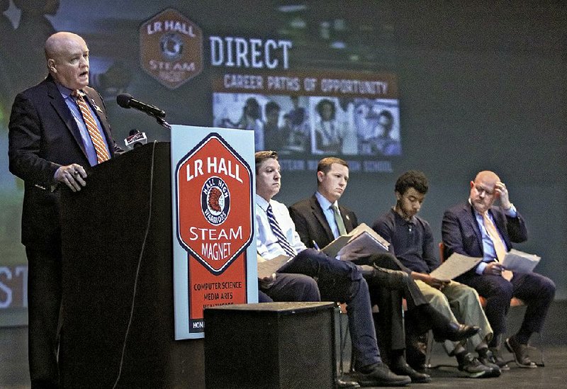 Little Rock Superintendent Mike Poore discusses the plan for the Hall STEAM Magnet High School on Tuesday. With Poore at the school are (from left) Joel Spencer, coordinator of the Hall STEAM program; James Reddish of the Greater Little Rock Chamber of Commerce; Trey Guire, who plans to attend Hall next year; and Jay Barth, chief education officer for Little Rock.
(Arkansas Democrat-Gazette/John Sykes Jr.)