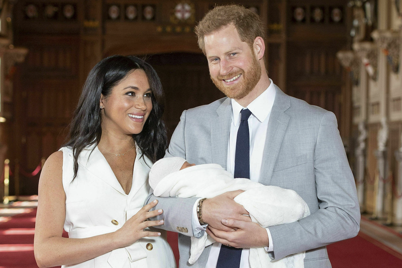 Britain's Prince Harry and Meghan, Duchess of Sussex, with their son Archie, in St George's Hall at Windsor Castle, Windsor, south England. 
(AP)