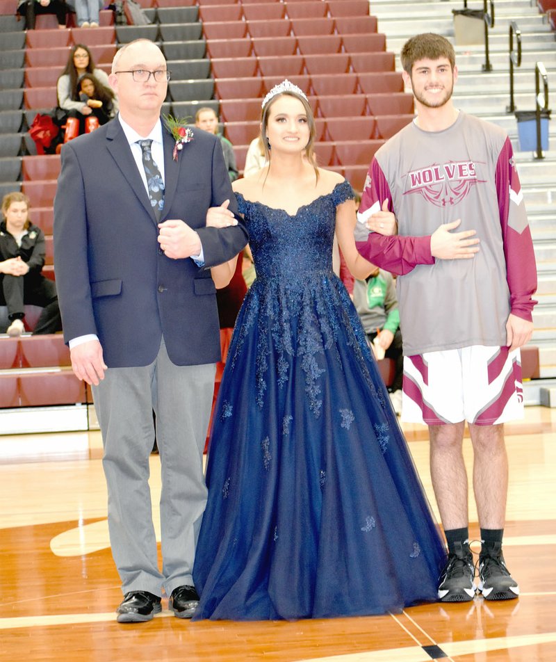 MARK HUMPHREY ENTERPRISE-LEADER/Senior maid Abby Goldman, daughter of Kelly and Ryan Goldman, escorted by her father and senior Clark Griscom, son of Curtis and Becky Griscom.