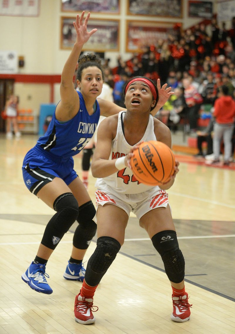 Fort Smith Northside's Jazzlyn Coleman (right) takes a shot in the lane Tuesday, Jan. 21, 2020, as Conway's Haylee Malcum defends during the first half in Kaundart-Grizzly Fieldhouse at Northside High School in Fort Smith. Visit nwaonline.com/prepbball/ for a gallery of photographs from the game. (NWA Democrat-Gazette/Andy Shupe)
