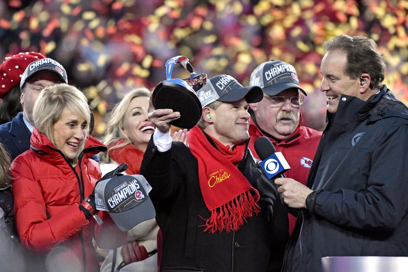Norma Hunt, left, and her son Clark Hunt, center, owners of the Kansas City Chiefs, and Kansas City Chiefs head coach Andy Reid, second right, celebrate after the NFL AFC Championship football game against the Tennessee Titans Sunday, Jan. 19, 2020, in Kansas City, MO. The Chiefs won 35-24 to advance to Super Bowl 54. (AP Photo/Jeff Roberson)