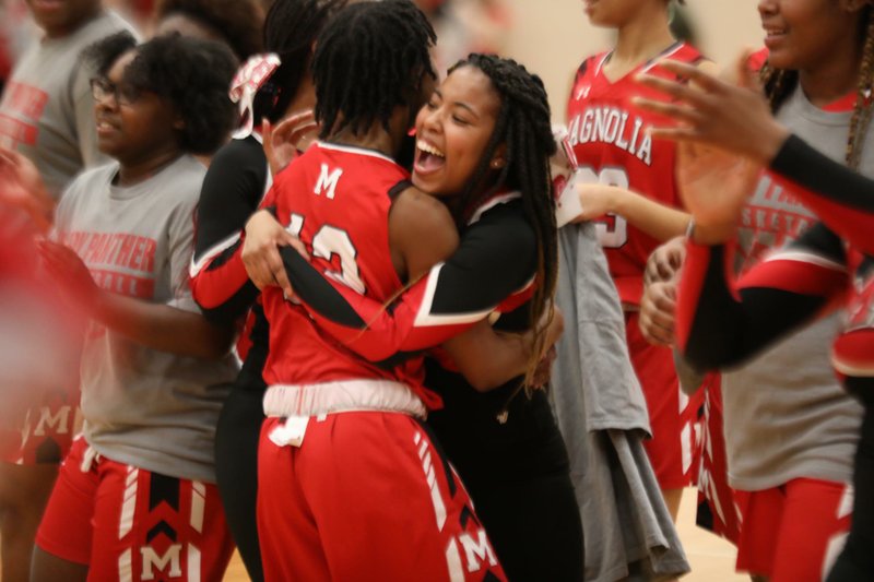 The Lady Panthers celebrate after a 13-point deficit is erased during their comeback win Tuesday in Camden. 