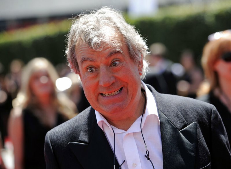 In this Saturday, Aug. 21, 2010 file photo, Terry Jones arrives at the Creative Arts Emmy Awards in Los Angeles. Terry Jones, a member of the Monty Python comedy troupe, has died at 77. Jones's agent says he died Tuesday Jan. 21, 2020. In a statement, his family said he died “after a long, extremely brave but always good humored battle with a rare form of dementia, FTD.” (AP Photo/Chris Pizzello, file)