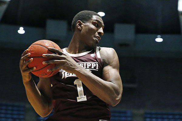 Mississippi State forward Reggie Perry (1) pulls down a rebound against New Mexico State during the second half of an NCAA college basketball game, Sunday, Dec. 22, 2019, in Jackson, Miss. (AP Photo/Rogelio V. Solis)

