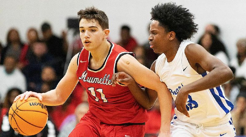 Sylvan Hills point guard Trent Clark drives to the basket for a layup during the first half of the Bears’ victory over the Hornets on Tuesday night at the Bears Den in Sherwood. 
(Arkansas Democrat-Gazette/Justin Cunningham)