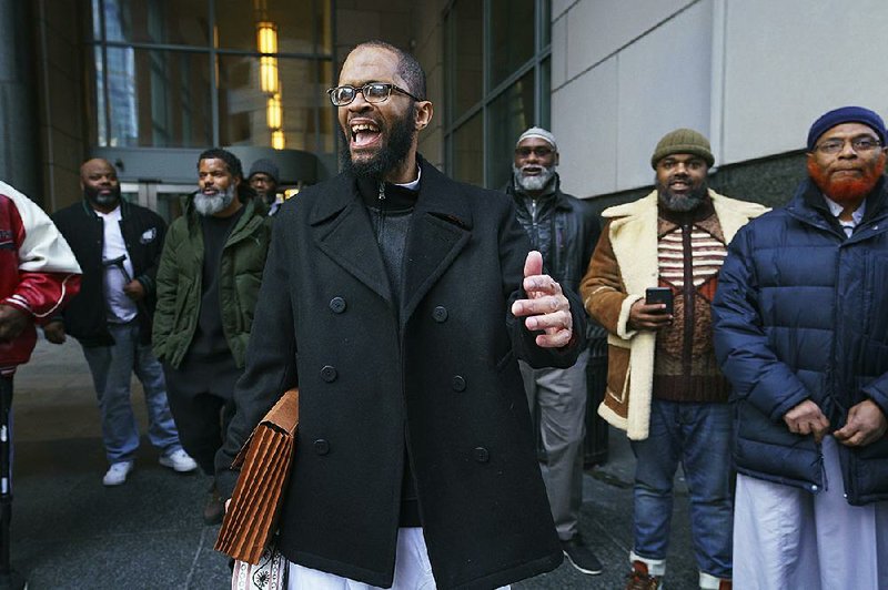 Theophalis Wilson, with friends and family members behind him, walks out of Philadelphia’s Criminal Justice Center on Tuesday.
(AP/The Philadelphia Inquirer/Jessica Griffin)