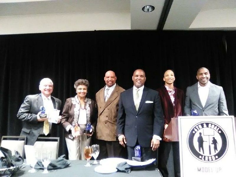 Members of the 2020 Little Rock School District One Rock Legends Hall of Fame class gather after Wednesday’s  ceremony at the Embassy Suites in Little Rock. They are (from left) Bill Keopple (son of inductee, the late CW  Keopple), Annette Fisher (mother of inductee Derek Fisher), Leslie O’Neal, Marcus Elliott, Tracy Scaife (brother  of inductee Tyler Scaife) and Duane Washington. Fisher, Scaife and Bernie Cox were unable to attend.
(Arkansas Democrat-Gazette/Jeremy Muck)