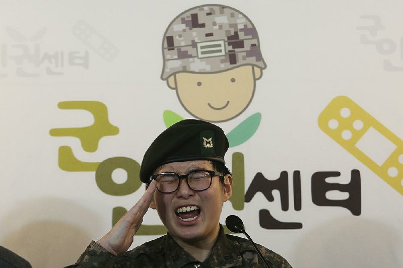 Byun Hui-su gives a salute Wednesday at a news conference in Seoul, where she asked military leaders to reconsider their decision.
(AP/Ahn Young-joon)