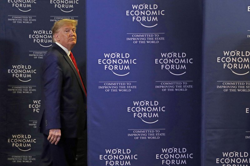 President Donald Trump leaves a news conference Wednesday in Davos, Switzerland. More photos at arkansasonline.com/123president/.
(AP/Evan Vucci)