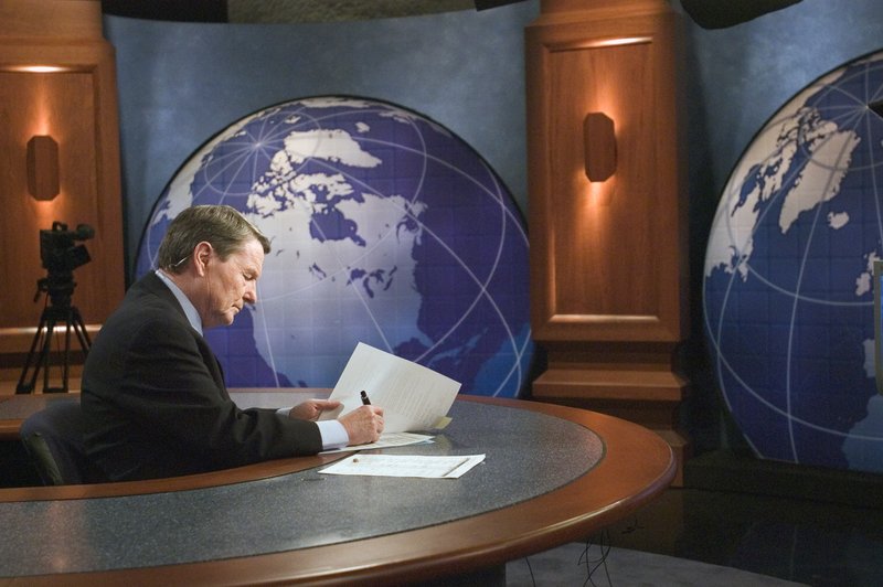 This 2004 image released by PBS shows journalist Jim Lehrer on the set of "PBS NewsHour with Jim Lehrer" in Shirlington, Va. PBS announced that Lehrer died Thursday, Jan. 23, 2020, at home. He was 85. (Peter Krogh/PBS via AP)